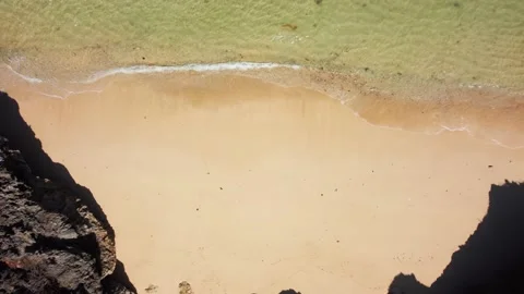 Birds eye view on small beach between cliffs Stock Footage 165773356