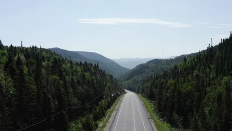Bird's eye view soaring overtop empty highway in the country 스톡 동영상 139415971