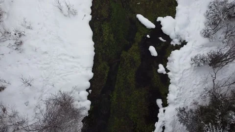 Birds Eye View of a Spring Flowing in Winter Stock Footage 217408010
