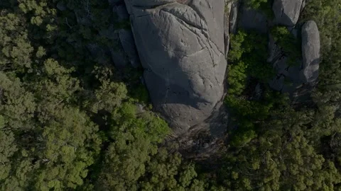 Bird's eye view of the steep drop off of Monkey Rock into the forest below. Stock Footage 262741825