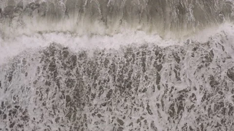 Birds-Eye View of Storm Waves on a Philippine Pebble Beach Stock Footage 157518322