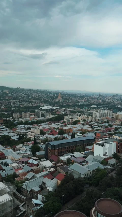 Birds eye view of streets and buildings in Old Tbilisi showcasing city life and Stock-Footage 322812951