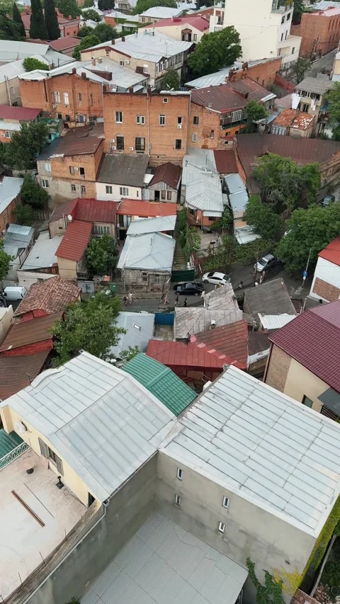Birds eye view of the streets of Old Tbilisi showcasing rooftops and homes Stock-Footage 322812976
