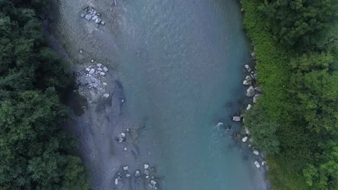 Birds eye view top down of a beautiful scenic small teal river flowing rocks Stockbeeldmateriaal 232027076