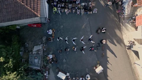 Bird's eye view top down perspective of traditional dancing at Stock Footage 248206175