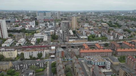 Bird’s eye view of a train passing through a city. Stock Footage 244697500