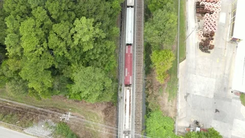 Birds eye view of train rolling through Stock Footage 161039780
