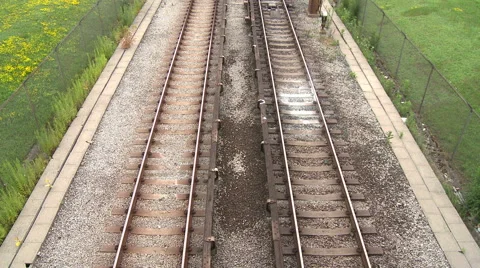 Birds eye view of train tracks while train passes through Stock Footage 45697669