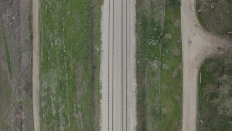 Bird's eye view of train tracks in rural area 스톡 동영상 136961227