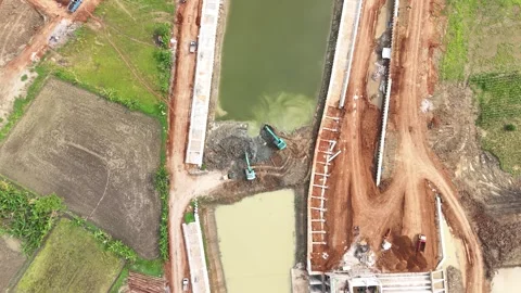 Bird's Eye View Of Two Escavators working inside Dam Contruction Stock Footage 293552120