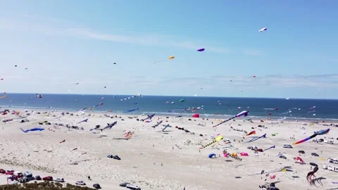 Bird's eye view of vibrant kite festival on the shore of Fano island Stock Footage 340166691