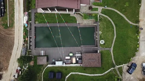 Bird's-eye view of white tent on green background Stock Footage 142531908