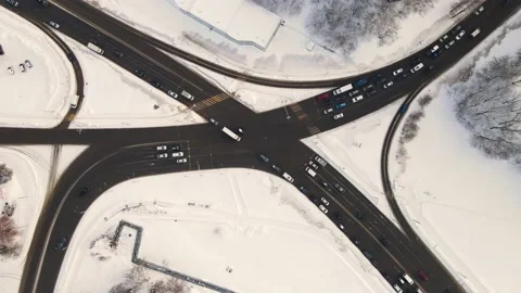 Bird's eye view in winter at the city crossroads with cars. Stock Footage 225416082
