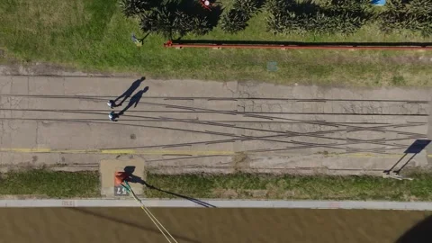 Bird's Eye View of Workers Walking at Oil and Gas Extraction Site Stock Footage 325965523