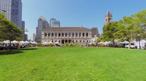 Birds fly above Copley Square with traffic at autumn Stock Footage 48952944