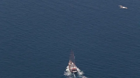 Birds fly around ship Stock Footage 73470425