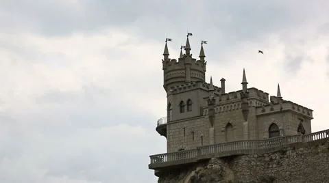 Birds fly over castle Swallow's Nest in Yalta, the Crimea Video stock 43201096