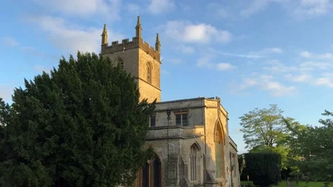 Birds flying around St. Edward's Church, Stow-on-the-Wold, Gloucestershire, UK Stock Footage 163583329