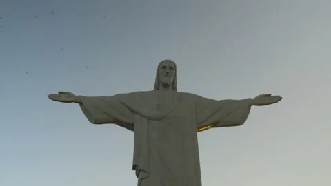 Birds flying over the Corcovado, at sunset, in Rio de Janeiro, Brazil Stock Footage 231542075