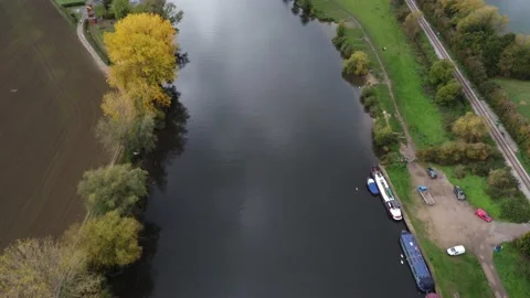 Birds Flying Over River Thames, Surrounded By The British Countryside Stock Footage 239612300