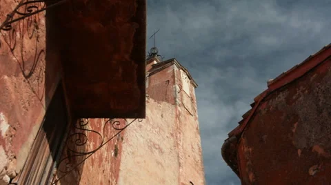 Birds flying at the top of the clock tower, Roussillon, Provence, France Stock Footage 66287182