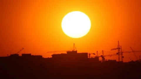 Birds over sunset town Stock Footage 74912268