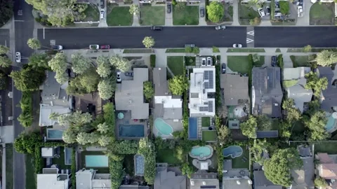 Birdseye aerial view above Van Nuys residential homes rooftops streets Stock Footage 163721130