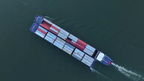 Birdseye view of cargo barge sailing on calm river waters. Supply chain Stock Footage 251728366