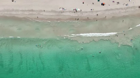 Birdseye view clear waves surfing swimmers Scarborough Perth Australia 4k Stock Footage 265866547