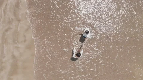 Birdseye View of Couple Dancing on the Sand Beach Video stock 156833403