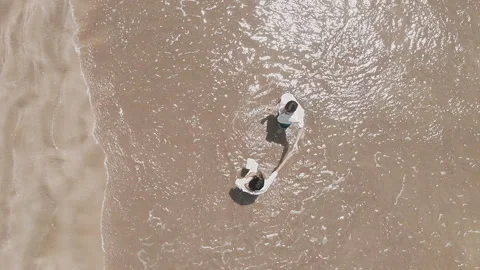 Birdseye View Of Couple Dancing On The Sand Beach Stock Footage 248572720
