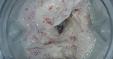 Birdseye View Of Fruit Being Blended Into A Fresh Smoothie From A Modern Blender Stock Footage 114014856