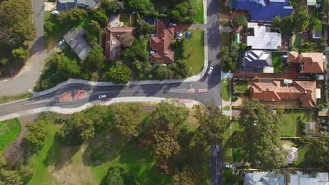 Birdseye view of a three-way intersection suburbs Stock Footage 92411844