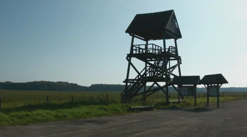 Birdwatching tower next to meadow Stock Footage 42475629