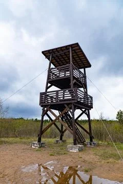Birdwatching Tower with Reflection on Cloudy Day Stock Photos