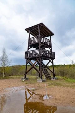 Birdwatching Tower with Reflection on Cloudy Day Stock Photos
