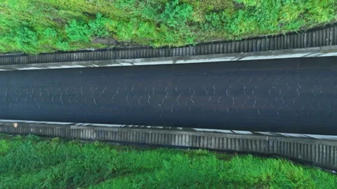 Birf Eye View of Dam Spillway Covered with Green Vegetation Stock Footage 309914146