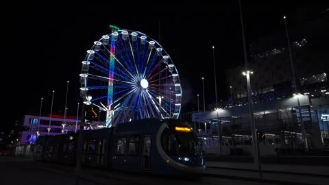 Birmingham Centenary Square at night with moving tram and people Vídeos de archivo 257703967