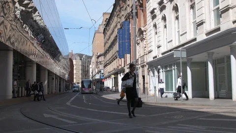 Birmingham, UK - May/17/2018: A Tram pulls up outside Grand Central Station. Video stock 90119853