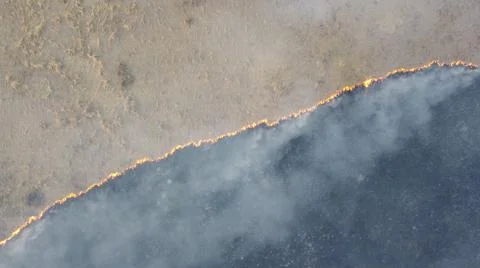 Birning Fields Aerial Shot, Burning Dry Grass, fire in the fields Stock Photos