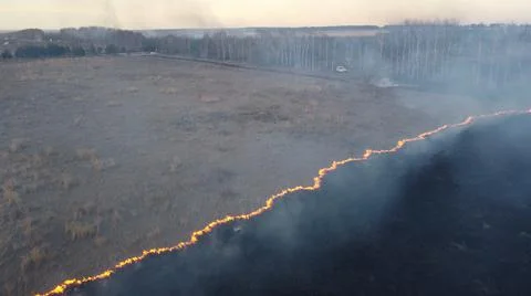 Birning Fields Aerial Shot, Burning Dry Grass, fire in the fields Stock Photos