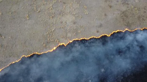 Birning Fields Aerial Shot, Burning Dry Grass, fire in the fields Stock Photos