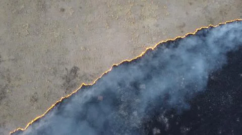 Birning Fields Aerial Shot, Burning Dry Grass, fire in the fields Stock Photos