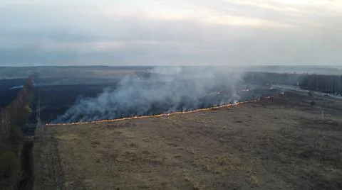 Birning Fields Aerial Shot, Burning Dry Grass, fire in the fields Stock Photos