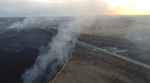 Birning Fields Aerial Shot, Burning Dry Grass, fire in the fields Stock Photos