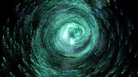 The birth of a galaxy. Many small glowing light green particles move in a cir Stock Footage 294970643