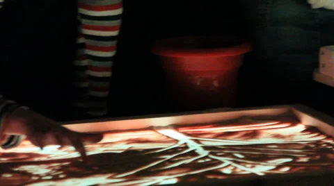 The birth of the paintings on the sand by human hands. A gift. The holiday. Stock Footage 33687925