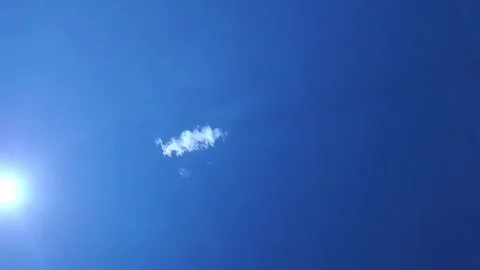 The birth of a white cloud in a blue sunny sky. Stock Footage 244989280