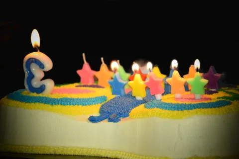 Birthday cake with colorful candles Stock Photos