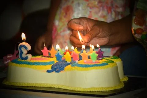 Birthday cake with colorful candles Stock Photos